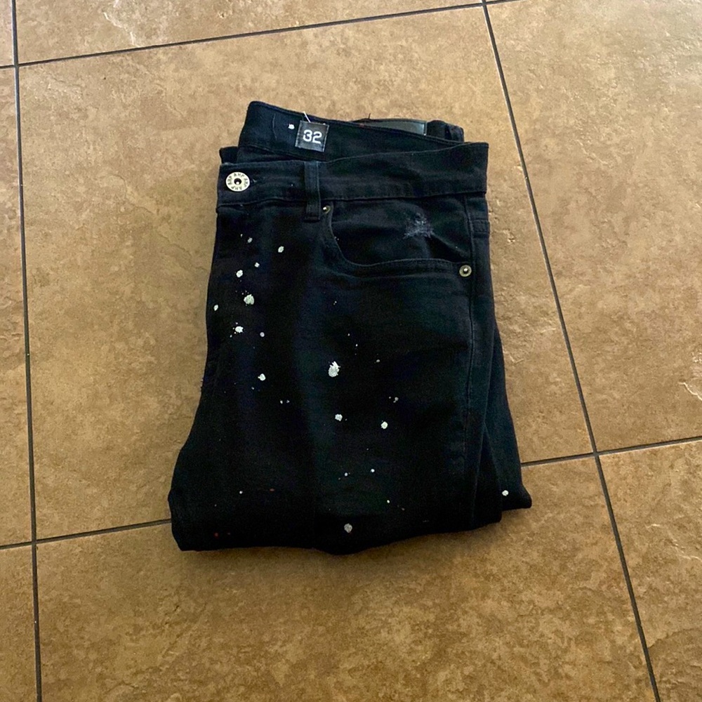 Black/red/white paint splatter jeans size is 32x32